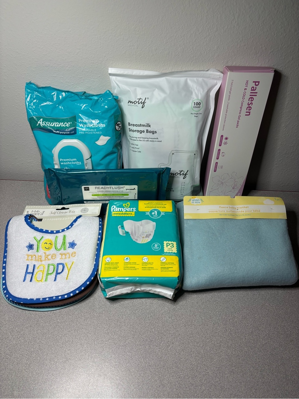 Baby Essentials Bundle 7 pieces - Motif 100 bags + Pampers P3 + Bibs + Blanket